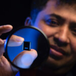 Intel Fellow Wilfred Gomes, a member of Intel’s Silicon Engineering Group, holds a processor with the advanced packaging technology called Foveros. It combines unique three-dimensional stacking with a hybrid computing architecture that mixes and matches multiple types of cores for different functions. (Credit: Walden Kirsch/Intel Corporation)