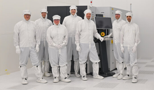 EV Group and Fraunhofer IZM-ASSID personnel next to an EVG®850 DB fully automated UV laser debonding and cleaning system installed in Fraunhofer’s newly established Center for Advanced CMOS and Heterointegration Saxony (CEASAX) in Dresden, Germany. From left to right: Gerald Silberer, Regional Sales Director Europe (EV Group); Dr. Andreas Gang, Group Leader Pre-Assembly / Wafer Bonding (Fraunhofer IZM-ASSID); Dr. Manuela Junghähnel, Site Manager (Fraunhofer IZM-ASSID); Markus Wimplinger, Corporate Technology Development & IP Director (EV Group); Andreas Pichler, Regional Sales Manager Europe (EV Group); Robert Wendling, Technical Assistant Wafer Bonding (Fraunhofer IZM-ASSID); and Dr. Frank Windrich, Deputy Site Manager (Fraunhofer IZM-ASSID). © Fraunhofer IZM / Silvia Wolf. 