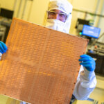 An Intel engineer holds a test glass core substrate panel at Intel's Assembly and Test Technology Development factories in Chandler, Arizona, in July 2023. Intel’s advanced packaging technologies come to life at the company's Assembly and Test Technology Development factories. (Credit: Intel Corporation)